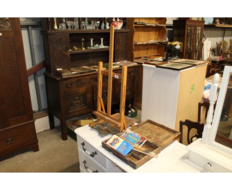 A travelling artists easel and a paint box