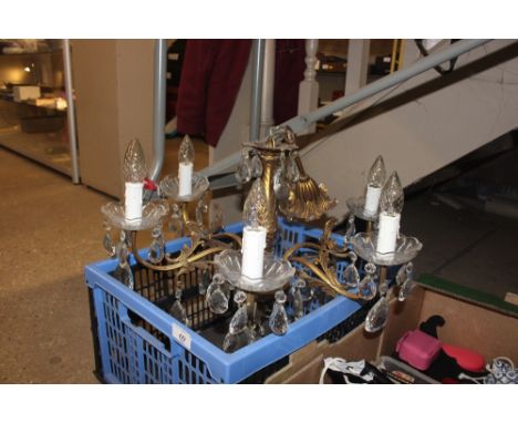 A brass and glass prism drop light fitting 