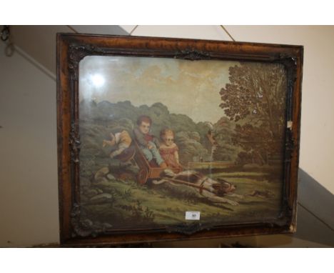 A VINTAGE PRINT DEPICTING CHILDREN IN A CART IN A CARVED OAK FRAME