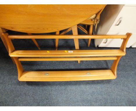 AN ERCOL STYLE HANGING WALL RACK