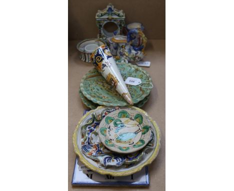 European faience pottery, including a clock case, sundial plaque etc 