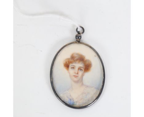 An early 20th century miniature hand painted watercolour portrait, in pendant frame, panel length 6cm 