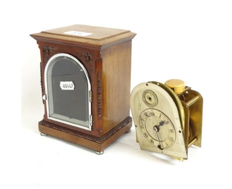 A small mahogany-cased mantel clock, with loose movement