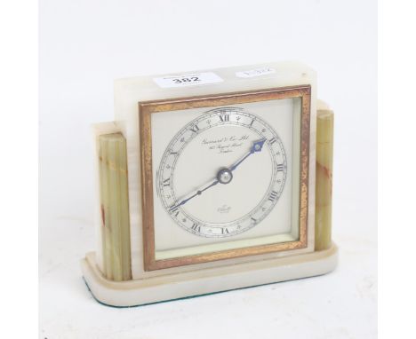 An Art Deco green and white onyx Elliott mantel clock, retailed by Garrard & Co Ltd, case height 13cm, working order 