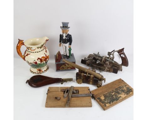 Various collectables, including brass table cannon, leather powder flask, novelty Uncle Sam money bank etc 