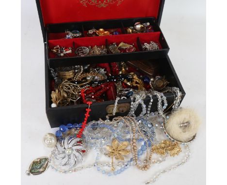 A cantilever jewel box, containing a quantity of Vintage and other costume jewellery, various brooches, necklaces etc 