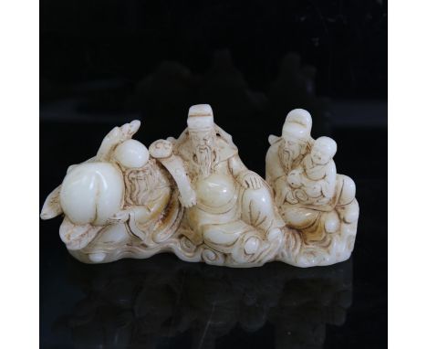 A Chinese polished jade elder figure group, length 16cm 