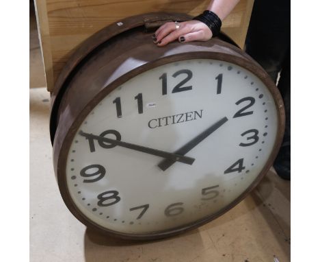 A large double-sided station style Citizen electric wall clock, diameter 69cm 
