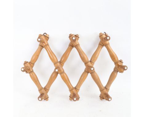 A Vintage pine simulated bamboo concertina hanging coat/hat rack, length 72cm 