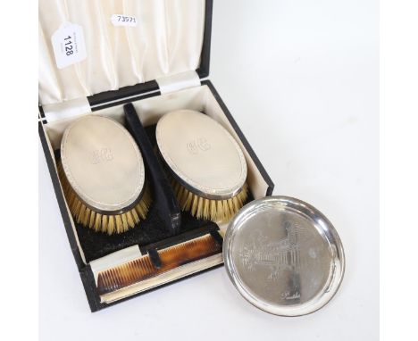 A modern circular silver pin dish, depicting The Pantiles, and a boxed silver-backed brush and comb set 