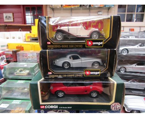 A boxed Corgi die cast 1:18 scale MGF 1.8i VVC Roadster and two boxed Burago 1:24 scale cars (3)