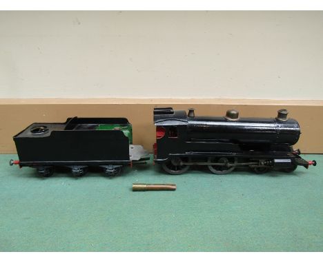 A live steam G scale 4-4-0 locomotive in black, 45mm gauge, 33.5cm long with associated tender 