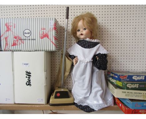 A mid 20th Century hard plastic walking doll with push-along Hoover carpet sweeper 