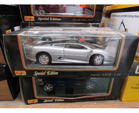 Two boxed Maisto 1:18 scale diecast cars, Jaguar XJ220 and McClaren F1