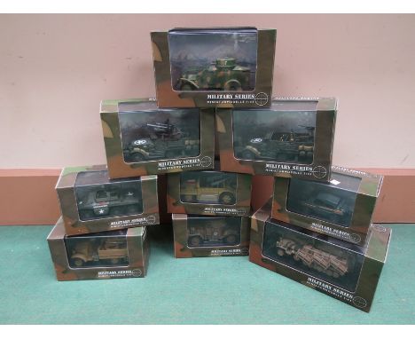 Nine perspex cased Schuco Military Series 1:43 scale models including tanks, armoured cars etc 