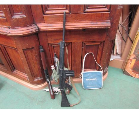 Assorted toy guns including Marx, a Marx fighter jet, Swissair bag 