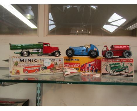 Two boxed Tri-ang Minic clockwork toys to include tinplate Tractor and Delivery Lorry together with boxed Minic plastic Push 