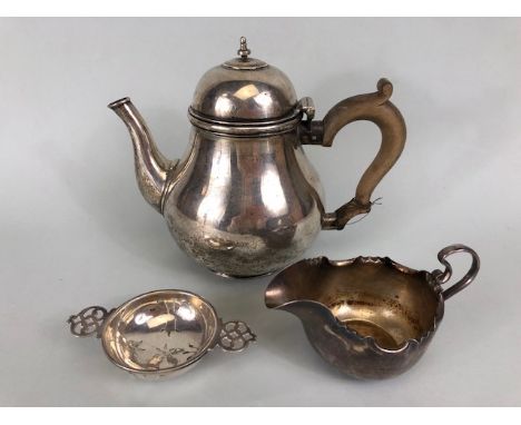 Silver hallmarked teapot (a/f), silver hallmarked milk jug and silver hallmarked tea strainer (total 617g)