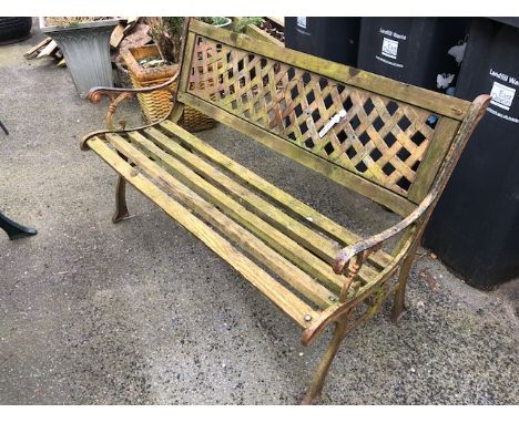 Metal framed bench with lattice work back