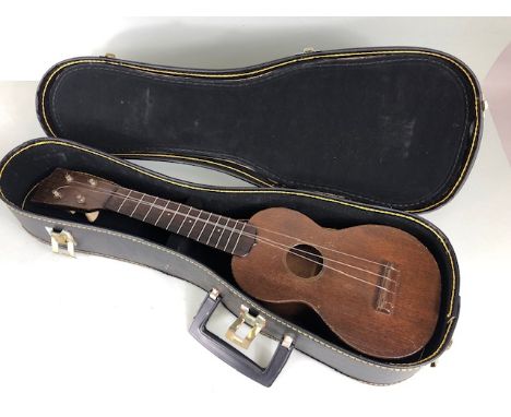 Musical Instruments,  Vintage Ukulele by C F Martin & Co circa 1920, Headstock with trade mark in gold C F Marti &Co Est 1833
