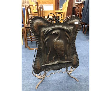 ARTS &amp; CRAFTS EMBOSSED COPPER EMBOSSED FIRESCREEN, depicting a bird, 72cm high