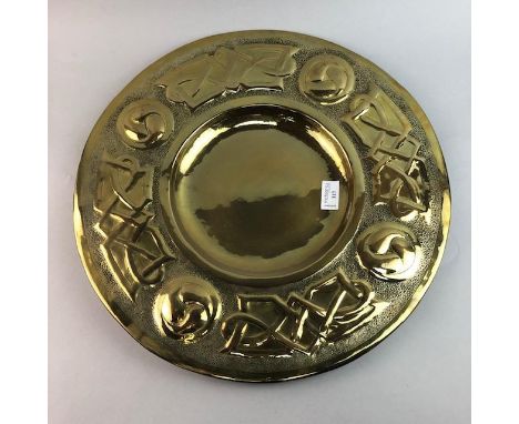 GLASGOW STYLE CIRCULAR BRASS WALL PLAQUE, with embossed Celtic decoration, 44cm diameter