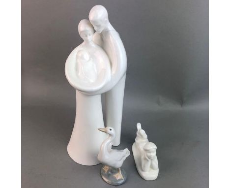 ROYAL DOULTON FIGURE GROUP, in white, 32cm high, along with another of a boy lying,10cm long, a Nao figure of a boy and a gro