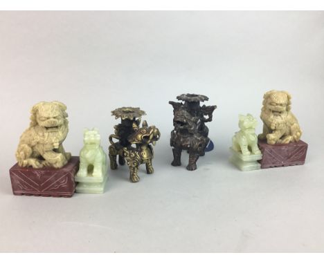 PAIR OF 20TH CENTURY CHINESE SOAPSTONE FOE DOGS, 10cm high, along with a jade carving and a pair of candle stands (6)