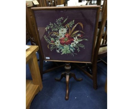 20TH CENTURY MAHOGANY FIRESCREEN, on tripod base, decorated with a floral scene, 90cm high, 50cm wide, along with a mahogany 