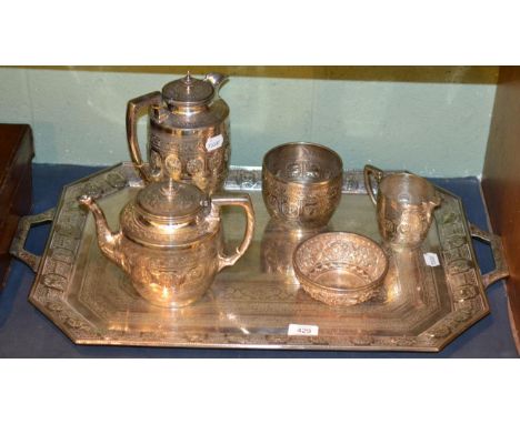 A silver plated Indian style five piece tea service comprising coffee pot, teapot, sugar bowl, milk jug and twin handled tray