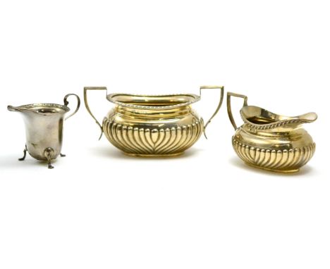 Silver sugar basin and matching cream jug, Birmingham hallmark and silver helmet shaped cream jug, Sheffield hallmark (3) CON