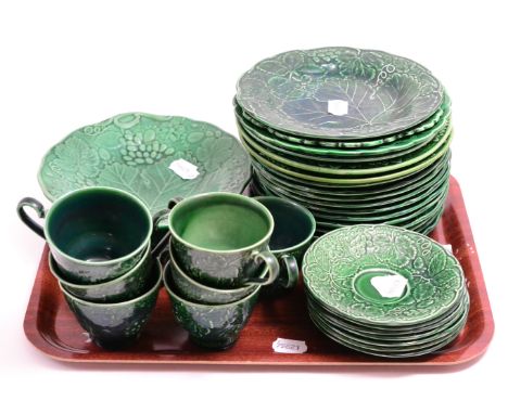 A group of Wedgwood and other Majolica leaf plates, tea cups and saucers (32 pieces) CONDITION REPORT: Sold as seen unless a 