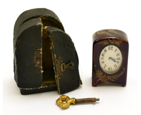 A miniature enamel timepiece, signed Zenith, circa 1910, the dark red enamel case with painted enamel ferns, hinged back engr