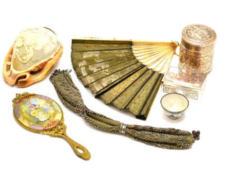 A mother-of-pearl handled fan, a gilt metal hand mirror, a miniature enamel bowl, etc  CONDITION REPORT: Sold as seen unless 