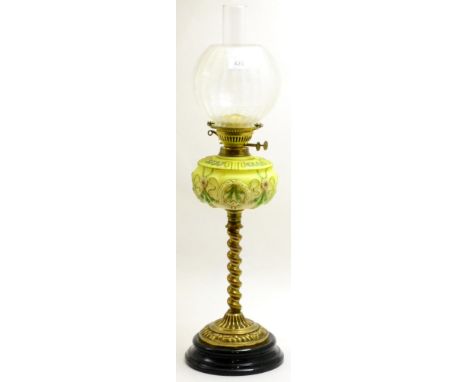 Victorian brass oil lamp with spiral turned support and a yellow glass reservoir, height excluding shade 50cm CONDITION REPOR