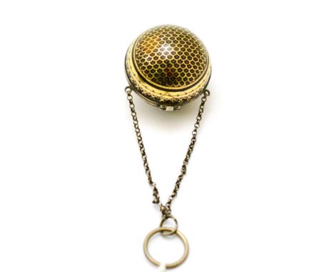 A late 18th/early 19th century tortoiseshell purse, ball shaped with gold geometric pique pose decoration, opening around the