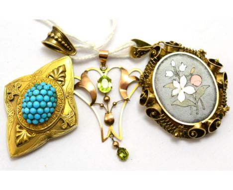 # A Victorian four pointed star pendant set centrally with bombe turquoise decoration, with locket back, measures 3.2cm by 5.