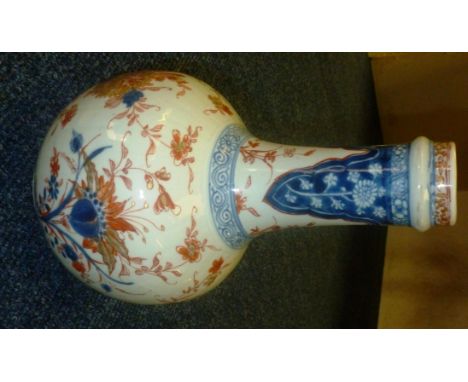 A Chinese Imari porcelain bottle vase, decorated with underglaze blue and overglaze iron with gilt highlights, the body with 