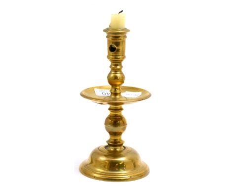 A mid-17th century Dutch Heemskerk candlestick, with turned and knopped stem, raised on a bell shaped base, height 20cm CONDI