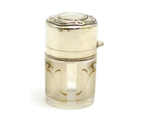An Art Nouveau silver topped jar, height 9cm CONDITION REPORT: Two opals missing, glass in good condition, silver in good con