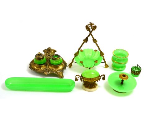 A collection of 19th century green opaline glass, mainly metal mounted, comprising: watch stand, egg trinket box, candle hold