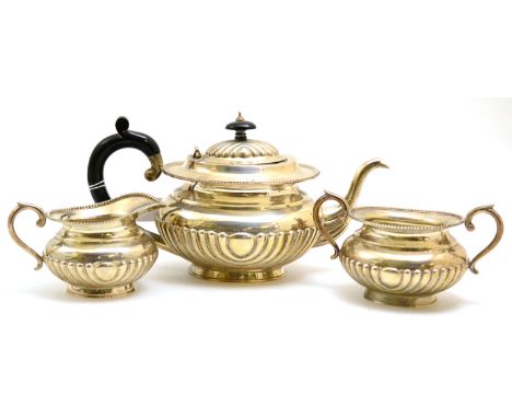 A three piece tea service, stamped 'Sterling Silver'  CONDITION REPORT: Good condition