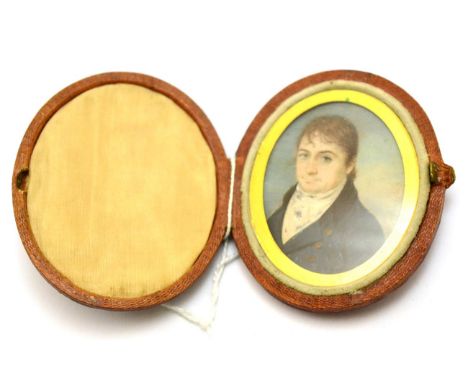 An early 19th century oval portrait miniature of a gentleman, fitted in a leather case with a wax seal CONDITION REPORT: 