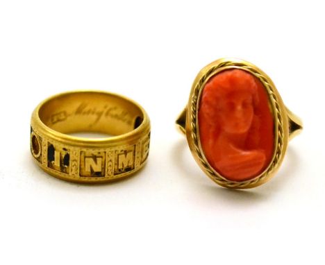 # A 9ct gold coral cameo ring, a portrait within a rope twist frame, finger size L and an 18ct gold mourning ring, (worn) bla