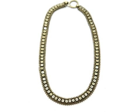 # A Victorian necklace, links with punched out star decoration, within foxtail link and bead borders, length 44cm  CONDITION 