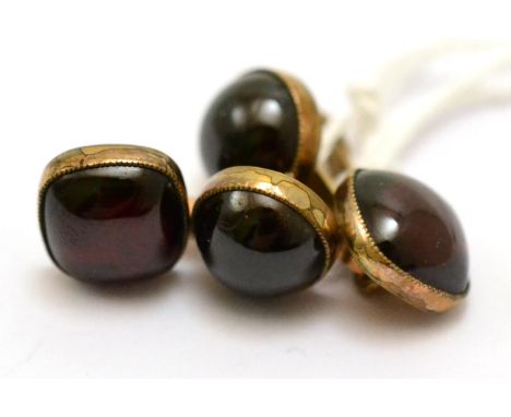 A pair of garnet cufflinks, each with a cushion shaped and a round cabochon foil backed garnet, bar linked  CONDITION REPORT: