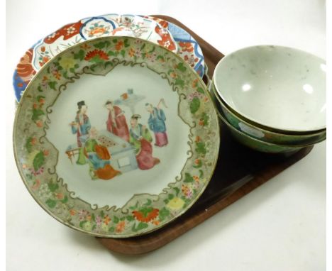 A pair of late 19th/early 20th century Chinese polychrome decorated tea bowls with turquoise ground and decorated with flower