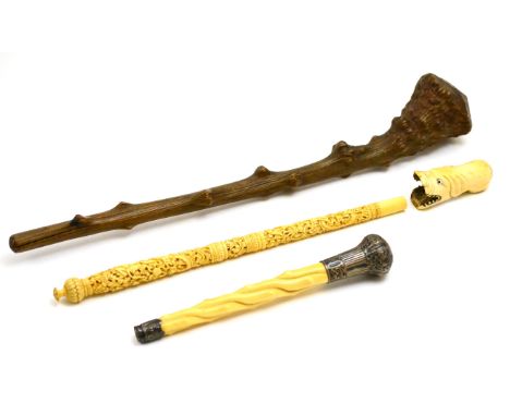 Three various early 20th century ivory and bone parasol/walking stick handles and a rootwood shillelagh (4) CONDITION REPORT: