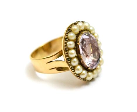 # A rose quartz and split pearl cluster ring, the pale pink quartz stone in a foil backed setting, to a split shouldered shan