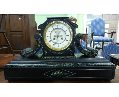 A black slate and marble striking mantel clock, signed Hry Marc, Paris, circa 1870, 5-1/2-inch enamel dial with a central vis